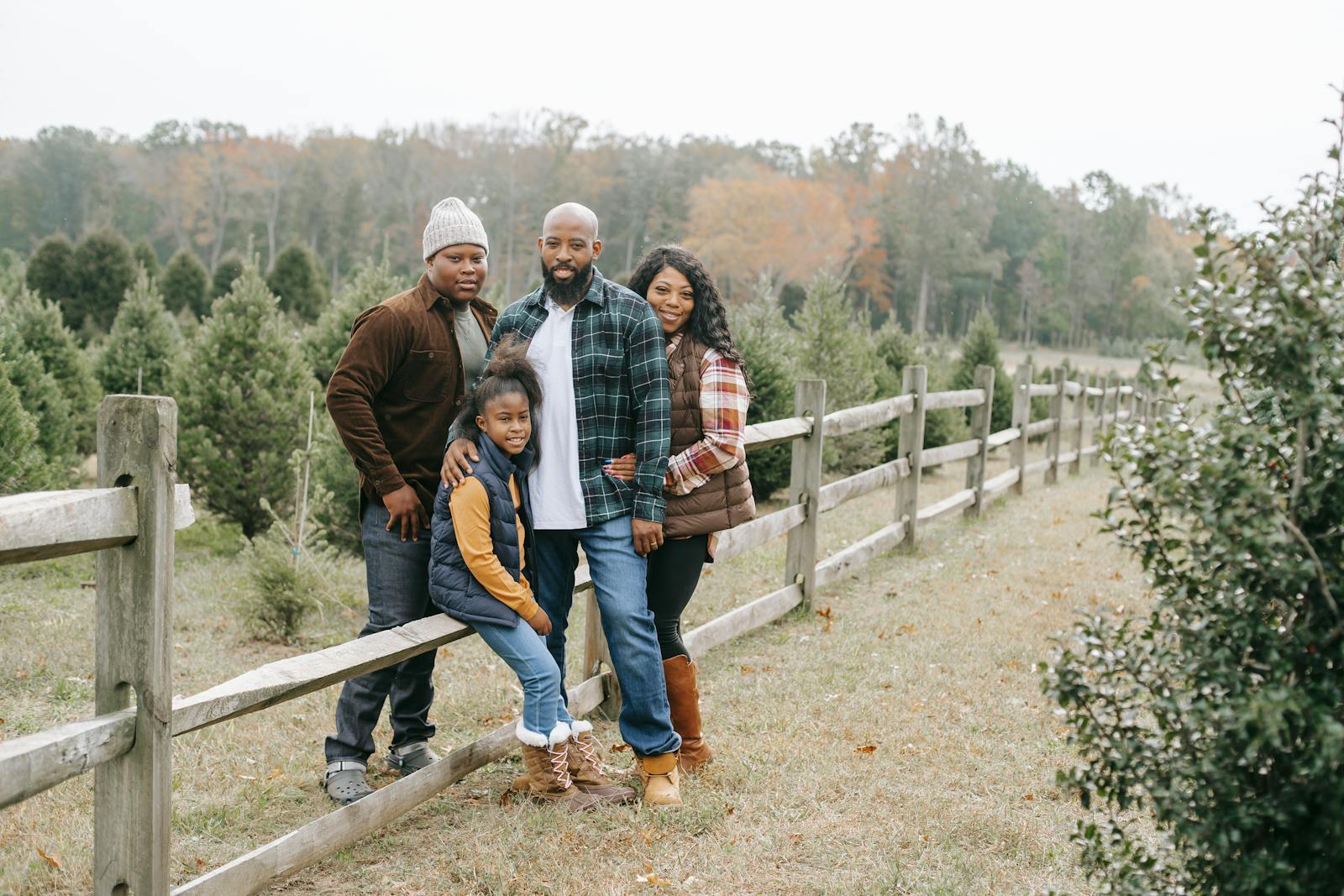 A diaspora mother holding her child close — warmth, trust, generational care