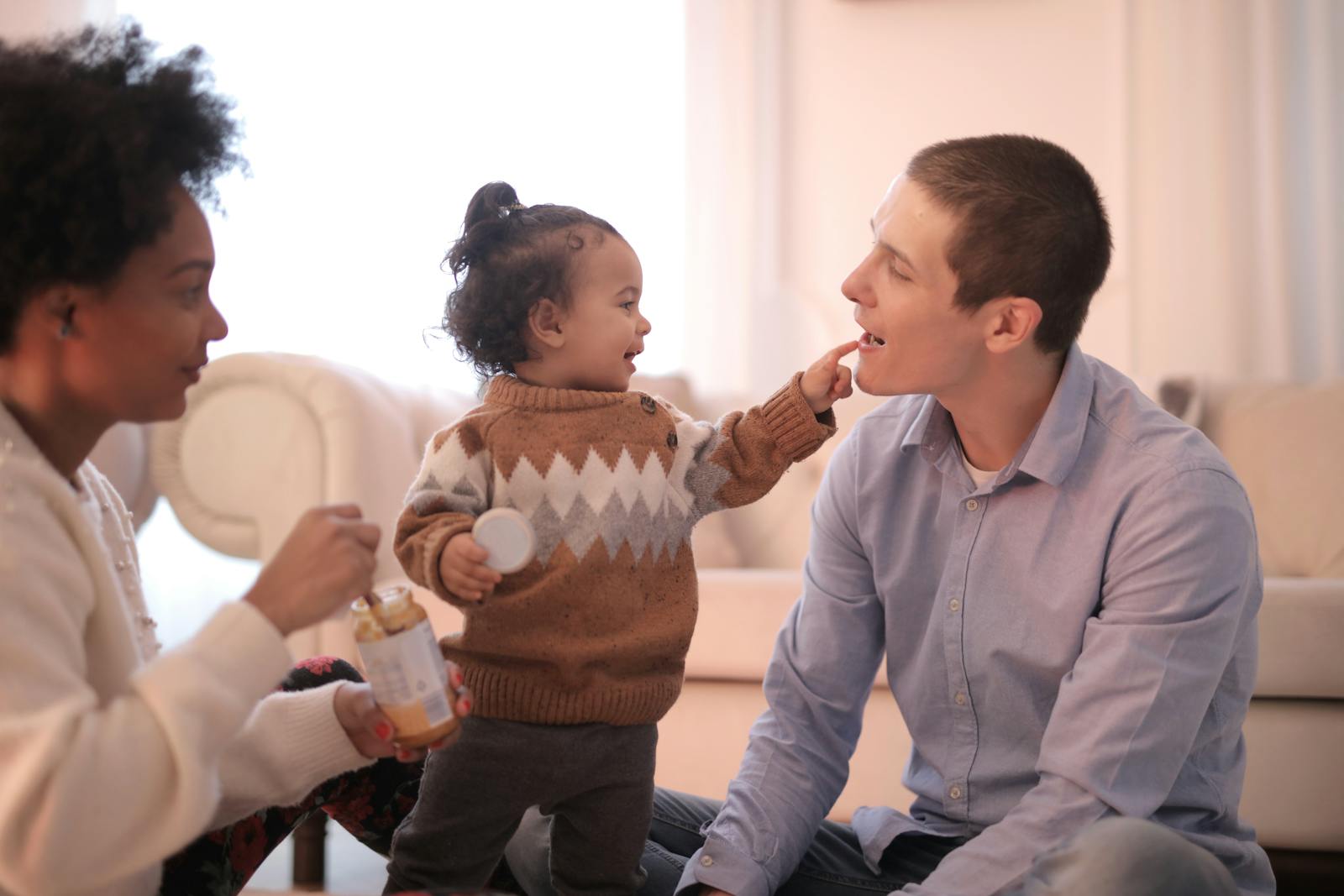 A mother holding her baby — quiet authority, familial warmth